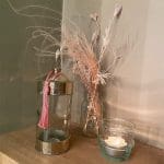 Moroccan handmade glass teapots next to other glass jars