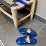 Moroccan handmade slippers in blue in a bathroom