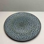 Moroccan handmade stoneware plate in green with leopard spot pattern