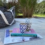 Your guide to Marrakech book with ceramic mug on top, on top of a rug