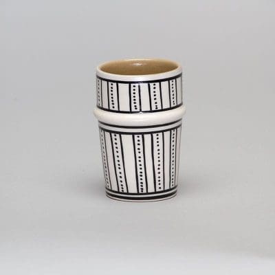 White beldi mug with black dot pattern
