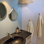 Moroccan handmade mirrors with gold rim hanging in a bathroom