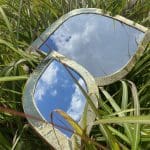 Two Moroccan handmade eyelid-shaped mirrors with gold trim, in different variants, lying next to each other