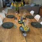 four Moroccan plates of green marbre on a covered table