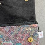 Handbag with chain in violet patterned fabric