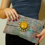 Handbag with chain in violet patterned fabric