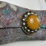 Handbag with chain in violet patterned fabric