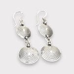 Silver dangling earrings with the spiral motif. Handmade in Tiznit, Morocco. Elegant and stylish.