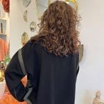 Cardigan/jacket_NOÍR SAUVAGE_in soft black fabric with green trim and snakeskin pockets