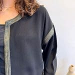 Cardigan/jacket_NOÍR SAUVAGE_in soft black fabric with green trim and snakeskin pockets
