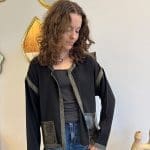 Cardigan/jacket_NOÍR SAUVAGE_in soft black fabric with green trim and snakeskin pockets