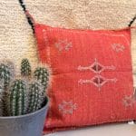 red motif 1. Cactus silk pillowcase with light green patterns.