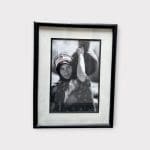 black and white photo in black frame of Berber woman