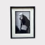 black and white photo in black frame with an elderly man from Morocco