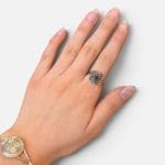 Silver ring with beautiful stone with unique, delicate silver carvings surrounding the black stone in the center.