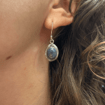 Oval sea blue stone dangle earring in silver